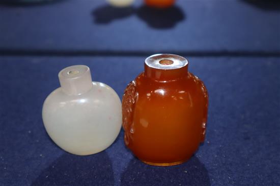 A Chinese agate snuff bottle and an amber glass snuff bottle